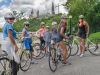 Guests have stopped at Rideau Canal with a view of the Parliament Building during Escape Ottawa express guided bike tour in Ottawa